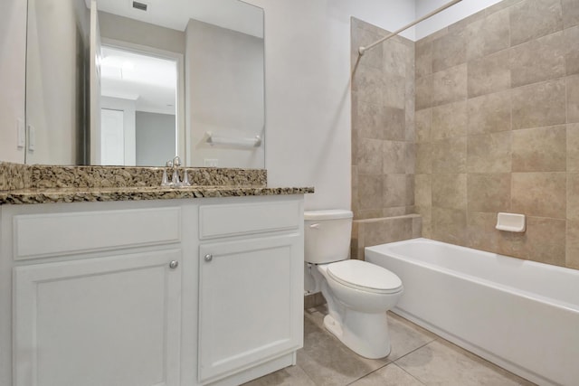 full bathroom with vanity, tiled shower / bath combo, tile flooring, and toilet