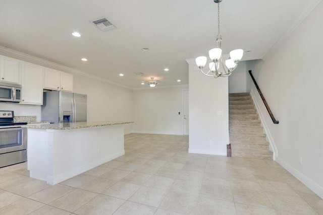 kitchen with light tile floors, stainless steel appliances, and a notable chandelier