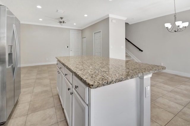 kitchen featuring light tile floors, light stone counters, stainless steel fridge with ice dispenser, white cabinetry, and a center island