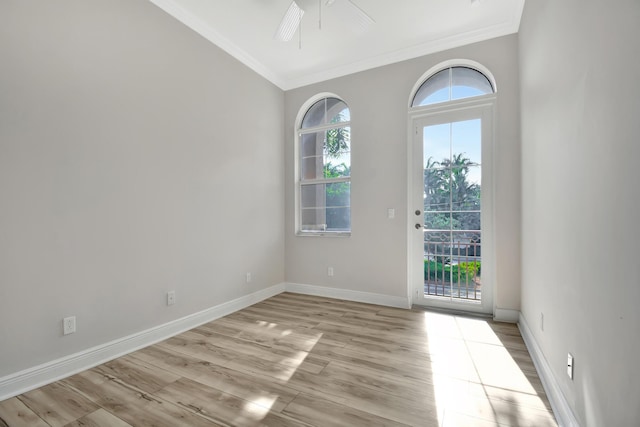 empty room featuring ornamental molding, light hardwood / wood-style floors, and ceiling fan