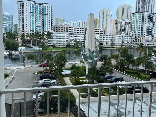 balcony featuring a water view