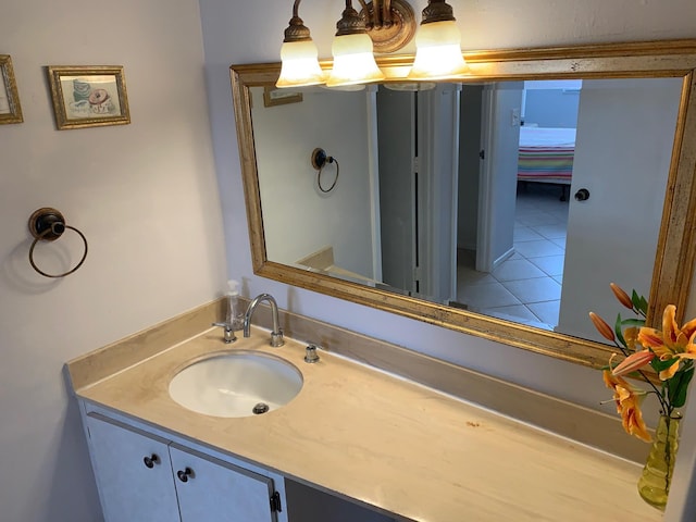 bathroom with tile floors and vanity with extensive cabinet space