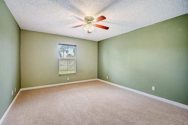 unfurnished room with light carpet, ceiling fan, and a textured ceiling