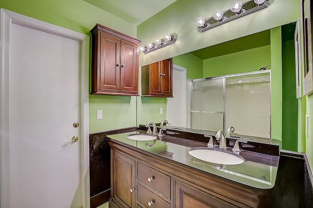 bathroom featuring oversized vanity and dual sinks