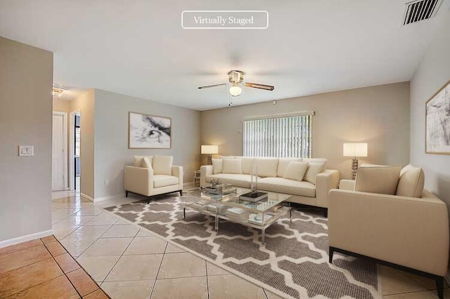 living room with light tile floors and ceiling fan