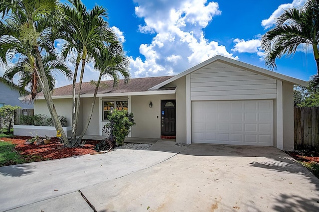 ranch-style home featuring a garage