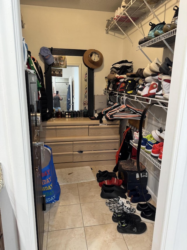 walk in closet featuring tile patterned flooring