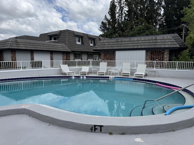 community pool with fence