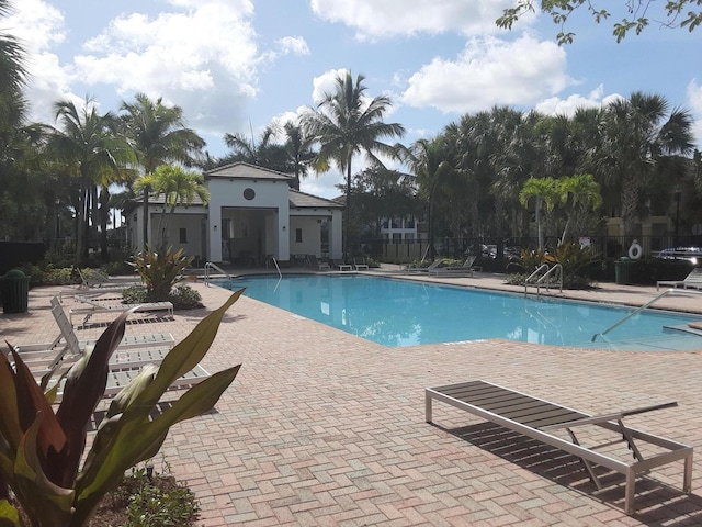 view of swimming pool with a patio area