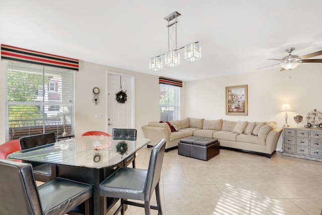 tiled dining area with ceiling fan