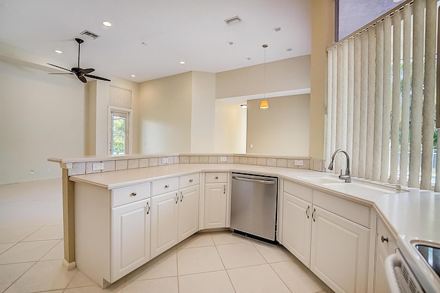 kitchen featuring light tile floors, kitchen peninsula, ceiling fan, and dishwasher