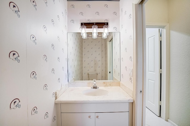 bathroom featuring toilet and vanity