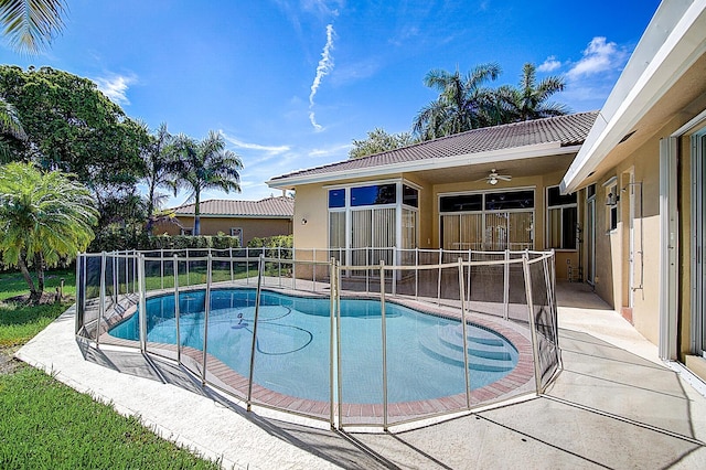 view of pool featuring a patio area and ceiling fan