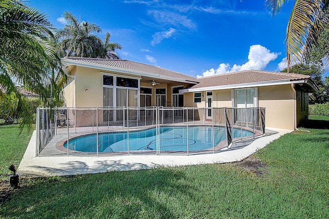 view of pool with a lawn and a patio area