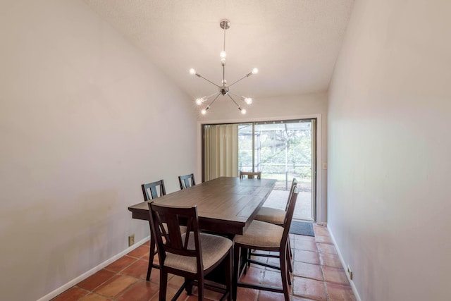 tiled dining area with a notable chandelier and lofted ceiling