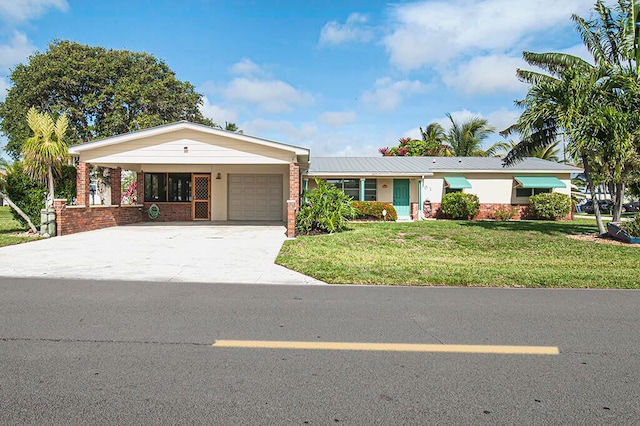 single story home featuring a front lawn and a garage