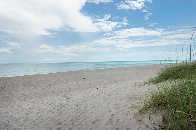 property view of water featuring a beach view