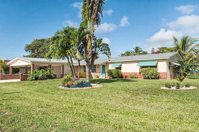 ranch-style house featuring a front lawn