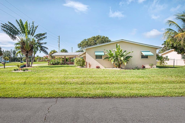 view of front of home with a front lawn