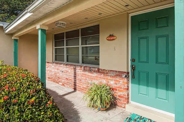 doorway to property featuring a porch