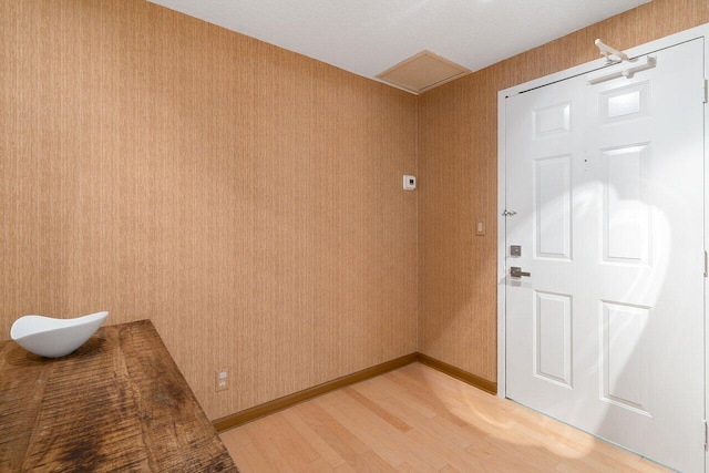 entrance foyer featuring hardwood / wood-style floors and a textured ceiling