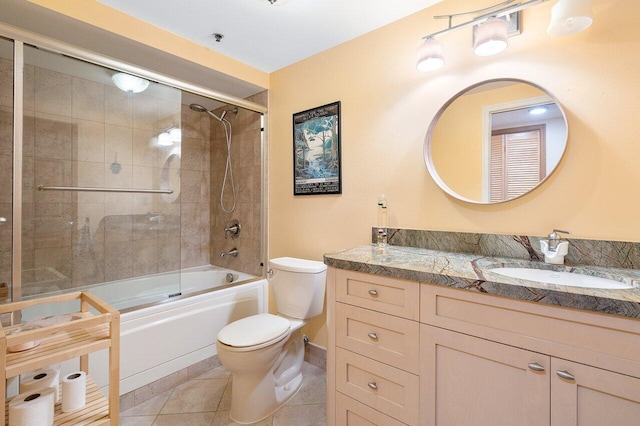 full bathroom with enclosed tub / shower combo, tile flooring, oversized vanity, and toilet