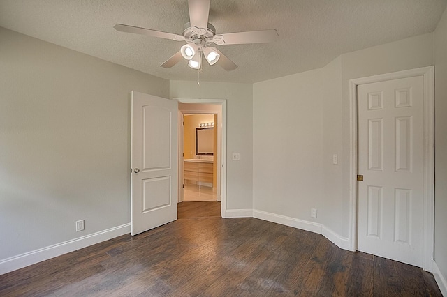 unfurnished bedroom with a textured ceiling, ceiling fan, and dark hardwood / wood-style floors