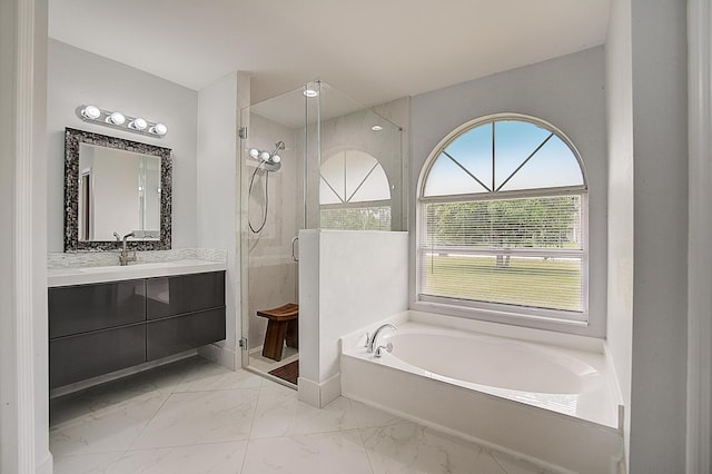 bathroom featuring shower with separate bathtub, tile floors, and oversized vanity