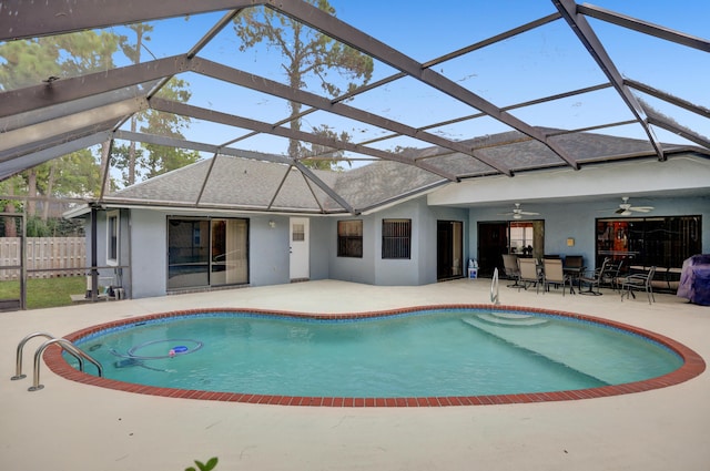 view of pool featuring a lanai, ceiling fan, and a patio area