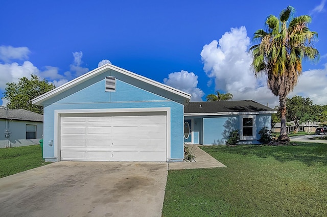 single story home featuring a front lawn and a garage