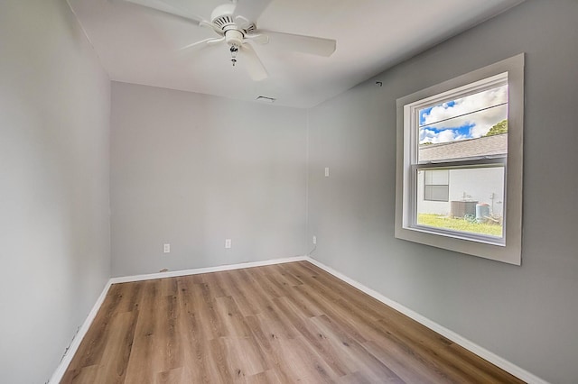 spare room with ceiling fan and light hardwood / wood-style flooring