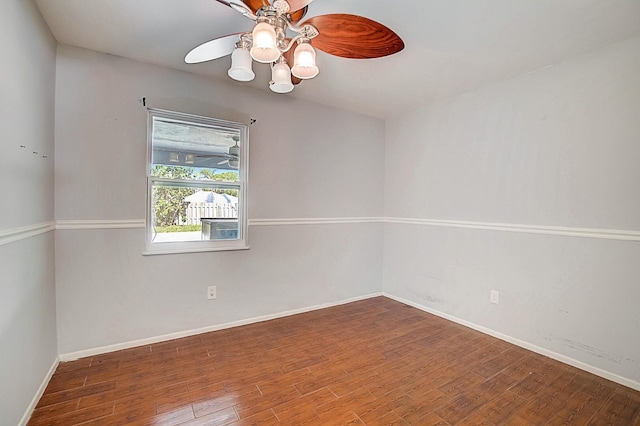 empty room with hardwood / wood-style floors and ceiling fan