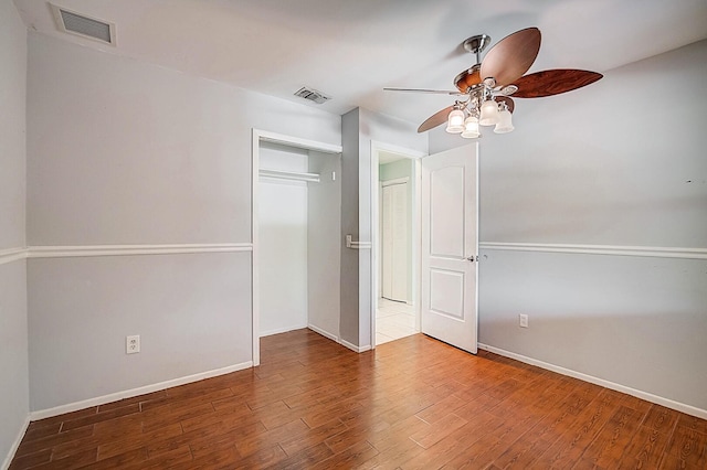 unfurnished bedroom featuring a closet, ceiling fan, and light wood-type flooring