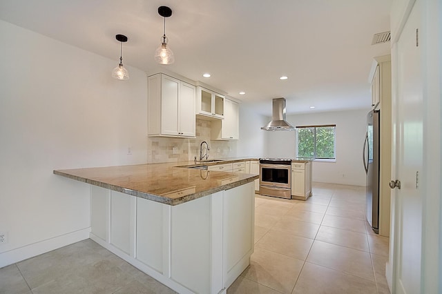 kitchen with range hood, kitchen peninsula, hanging light fixtures, and appliances with stainless steel finishes