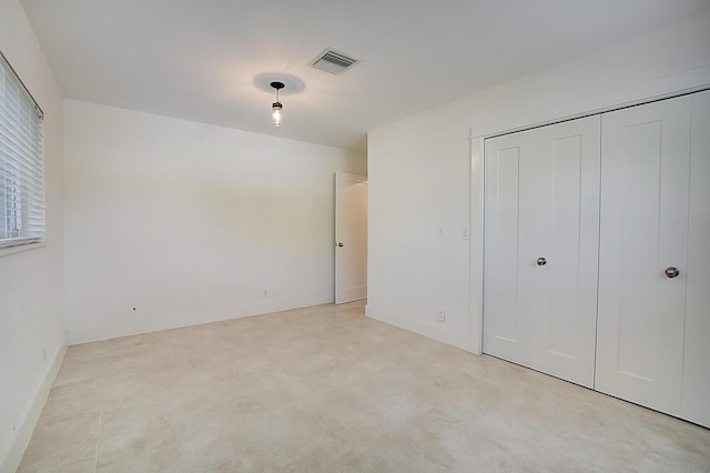 unfurnished bedroom with a closet