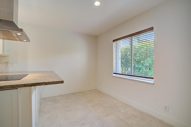 interior space featuring light tile floors