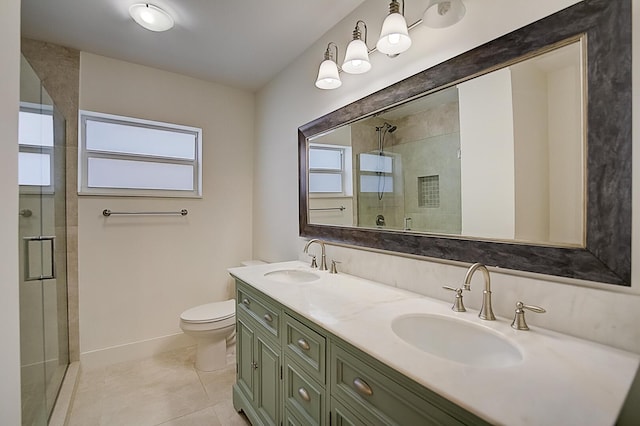 bathroom with tile floors, a shower with shower door, toilet, and dual bowl vanity