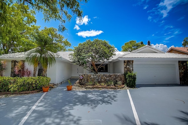 single story home featuring a garage