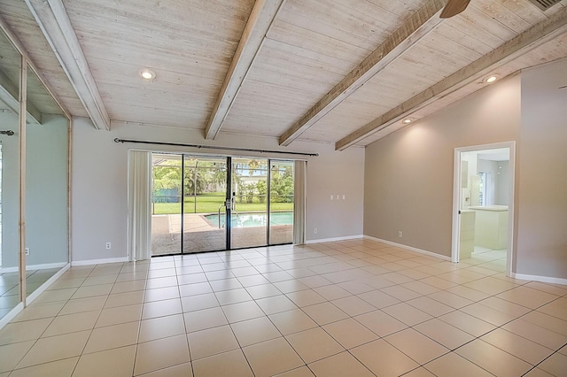 tiled spare room featuring wood ceiling, ceiling fan, and lofted ceiling with beams