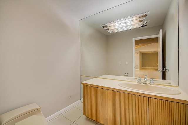 bathroom with oversized vanity, toilet, and tile floors