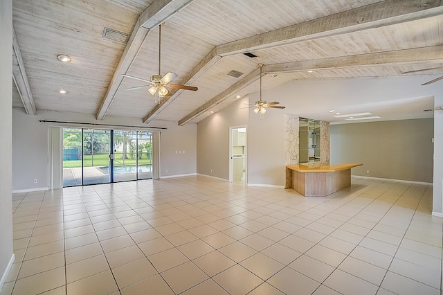 spare room with light tile floors, ceiling fan, and lofted ceiling with beams