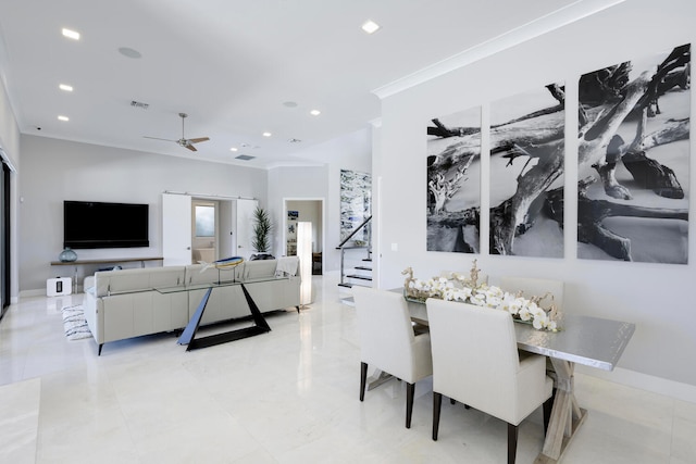 tiled dining area with ornamental molding and ceiling fan