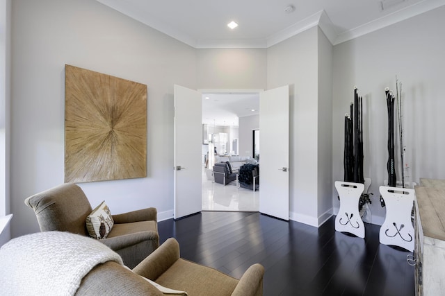 living room featuring a towering ceiling, dark tile floors, and ornamental molding