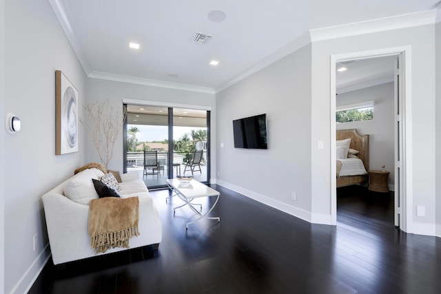 living room featuring a wealth of natural light, dark hardwood / wood-style floors, and crown molding