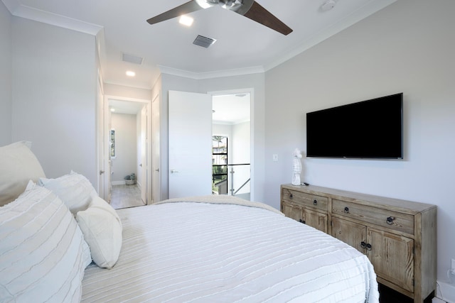 bedroom featuring crown molding, ensuite bathroom, and ceiling fan