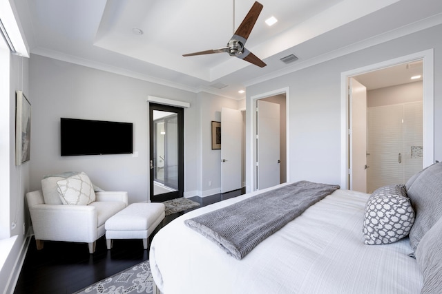 bedroom with ornamental molding, ceiling fan, and a tray ceiling