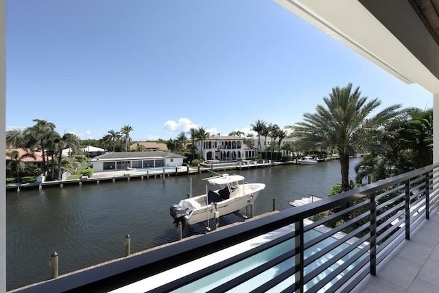 dock area featuring a balcony and a water view