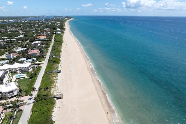 bird's eye view featuring a beach view and a water view