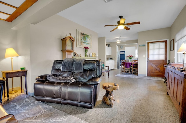 living room with ceiling fan