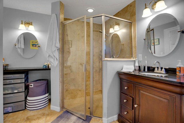 bathroom with an enclosed shower, tile floors, and large vanity